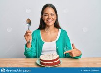 beautiful-hispanic-woman-eating-carrot-cake-smiling-happy-pointing-hand-finger-226745108.jpg