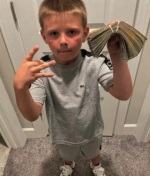 blonde_kid_dripped_out_holding_cash.png